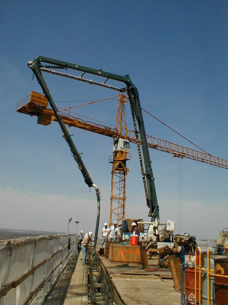 Placing Boom Rides Formwork to Pour 9,000-Yd Highrise Core